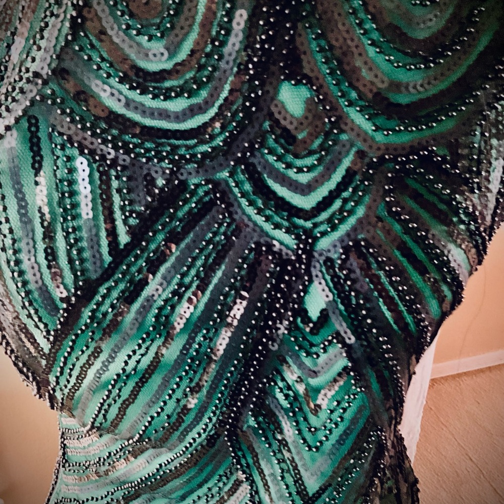 Black beaded dress over green with tassels on bottom - Picture 4 of 8